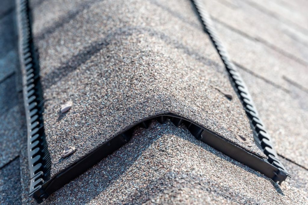 Ridge cap vent installed on a shingle roof, Maple Grove