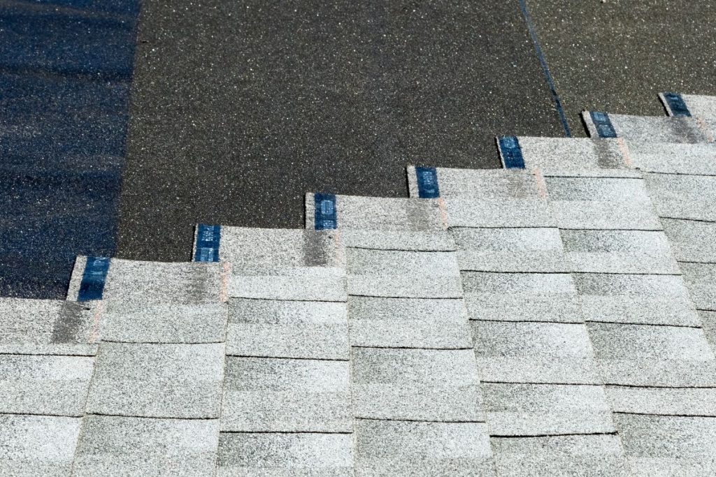asphalt shingles being installed on top of roof underlayment, Maple Grove, Minnesota